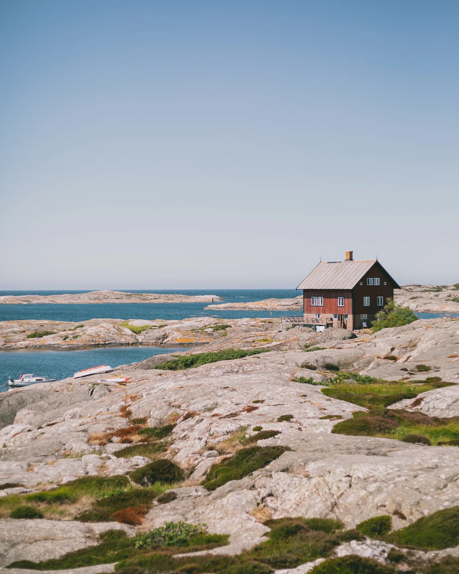 Wooden house on the rocks by the water in the archipelago