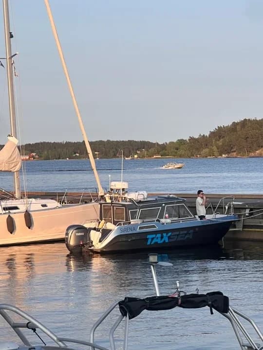 TaxSea's boat Sirena moored at the jetty in Vaxholm